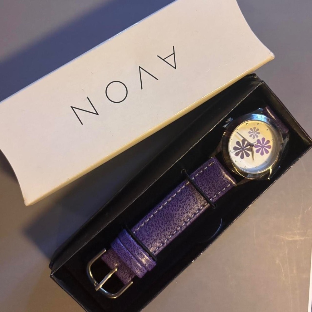 Purple Avon watch with white face
